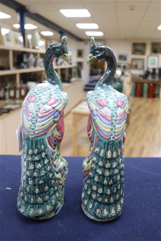 A pair of Chinese famille rose models of peacocks, 19th century Height 32cm